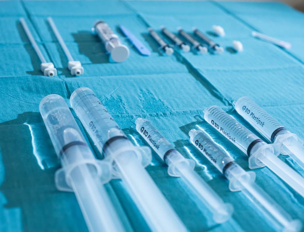 Specialist performing ultrasound-guided knee injection